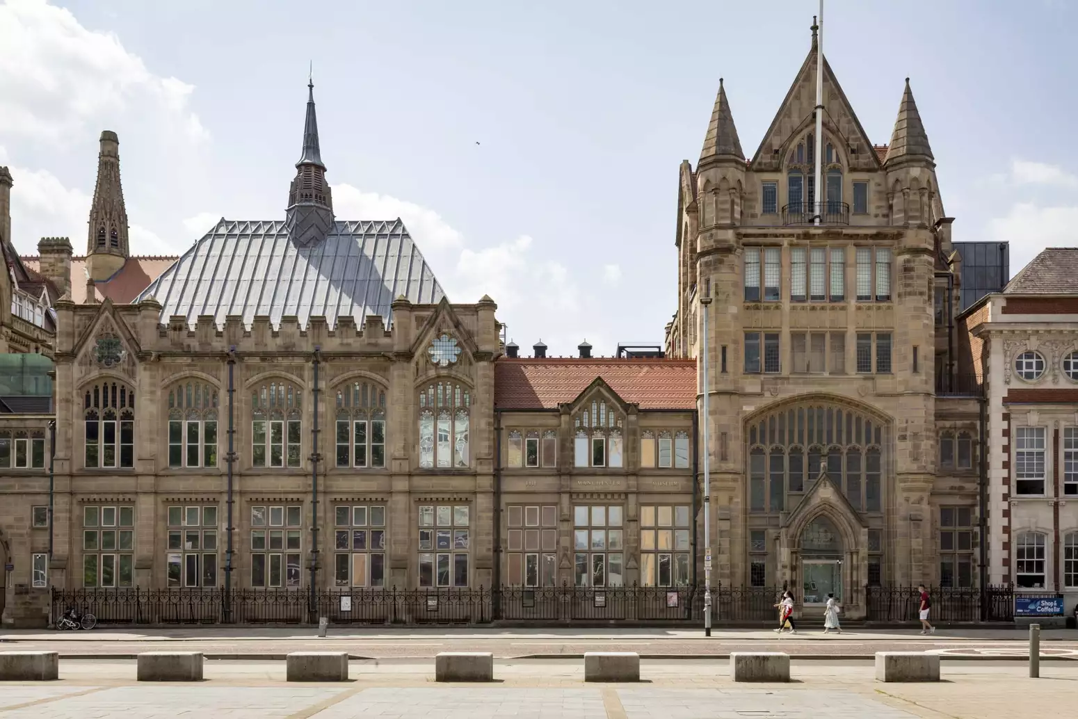 Manchester Museum photographed on a bright day from across the street
