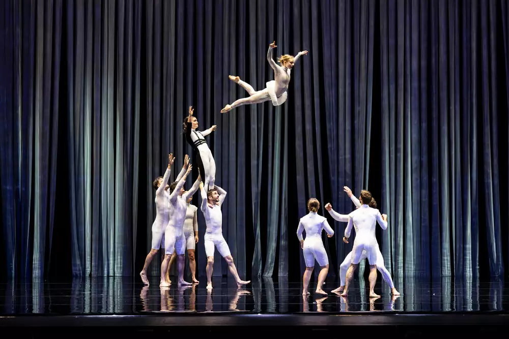 Circa acrobats performing on stage dressed as ducks and swans